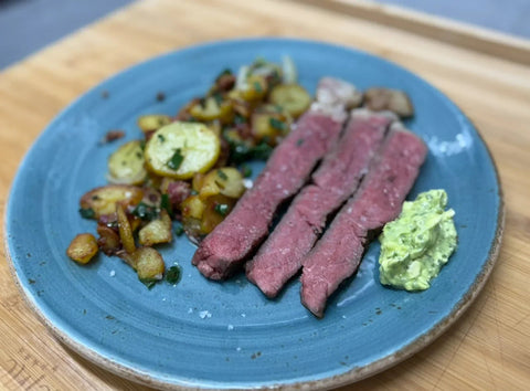 T-Bone-Steak mit Bratkartoffeln und Speck